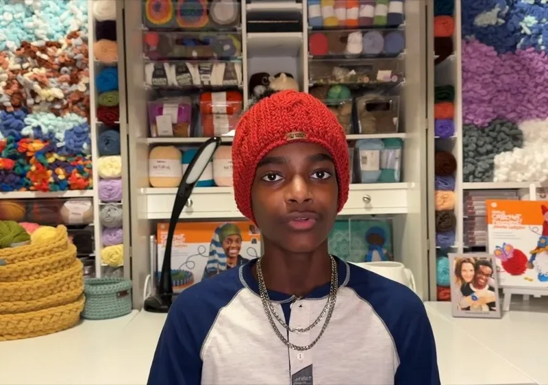 Cable ribbed hat with front post cables and pom pom