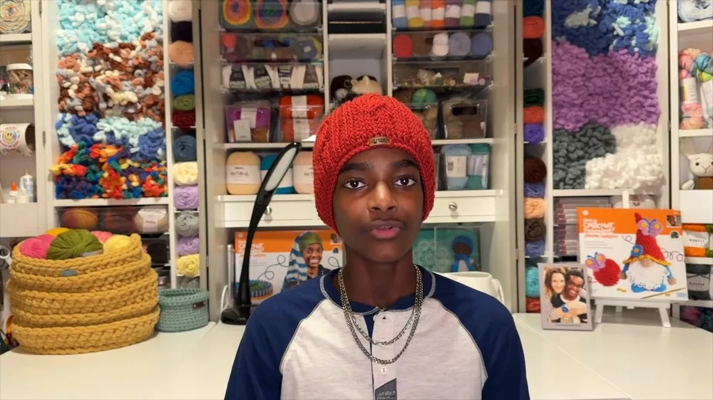 Cable ribbed hat with front post cables and pom pom