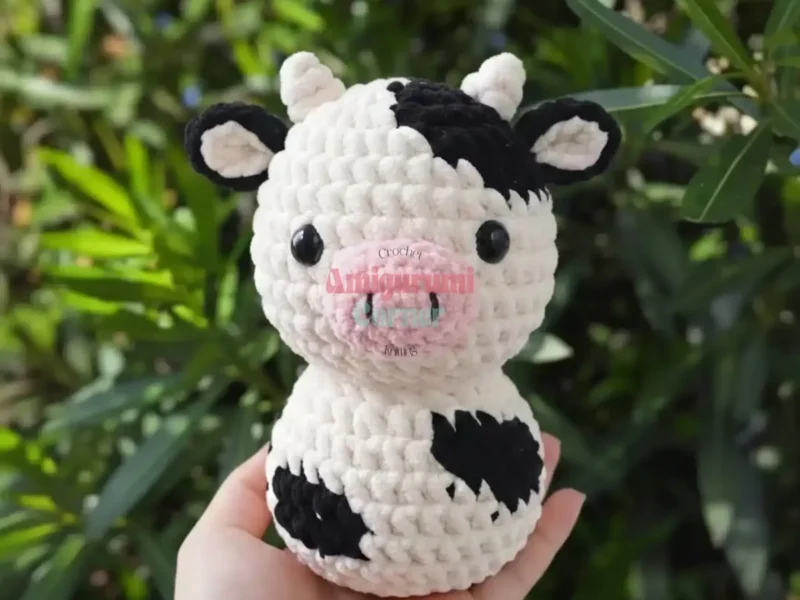 Crochet amigurumi cow pattern with horns and safety eyes