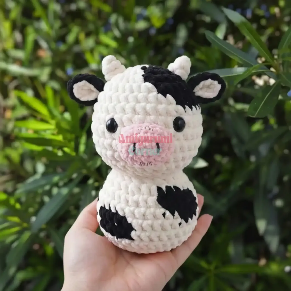 Crochet amigurumi cow pattern with horns and safety eyes