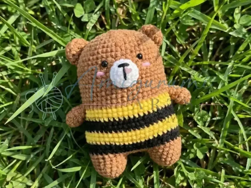 Crochet bear amigurumi with a striped bee sweater
