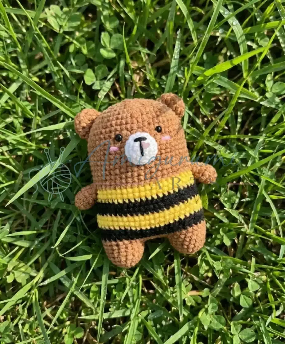 Crochet bear amigurumi with a striped bee sweater