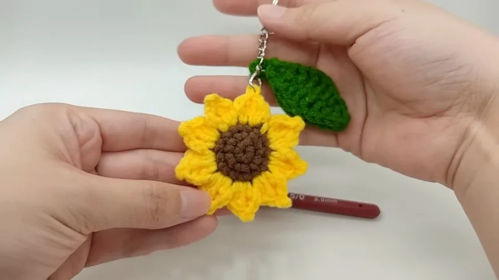 Crochet sunflower keychain pattern with petal and leaf shaping