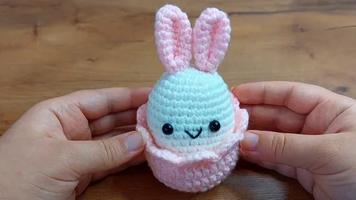 Egg-shaped crochet bunny with a removable double crochet shell