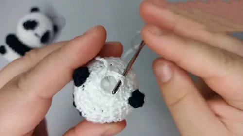 A compact panda amigurumi keychain worked in six rounds — photo 3