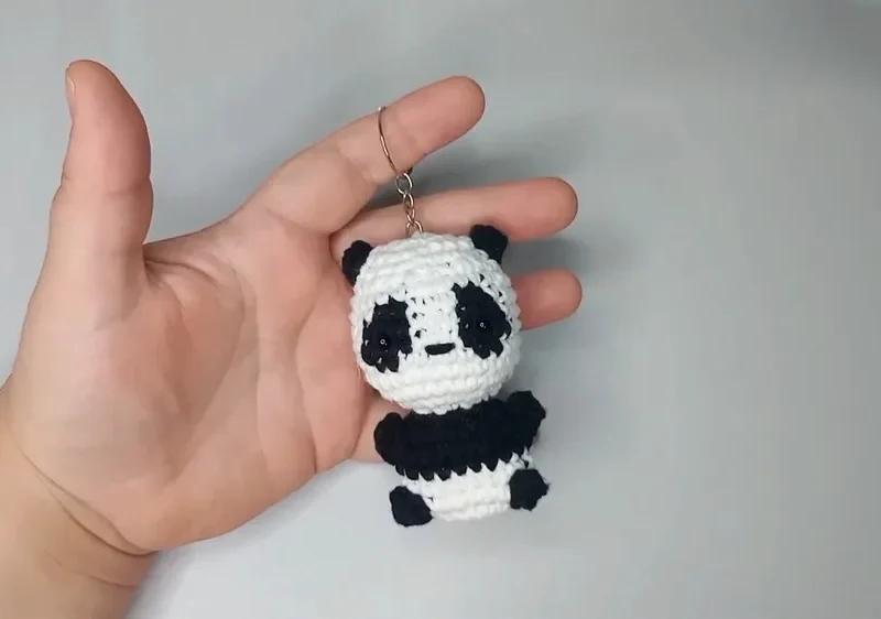 A compact panda amigurumi keychain worked in six rounds