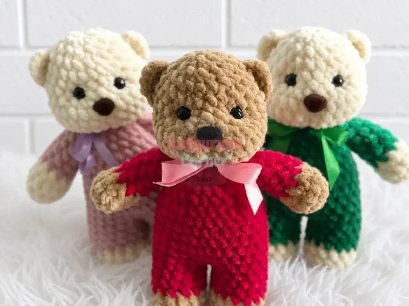 A soft-bodied amigurumi teddy bear in two colours