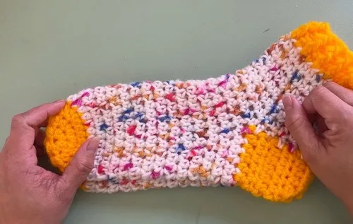 Two-tone half double crochet socks with ribbed cuff